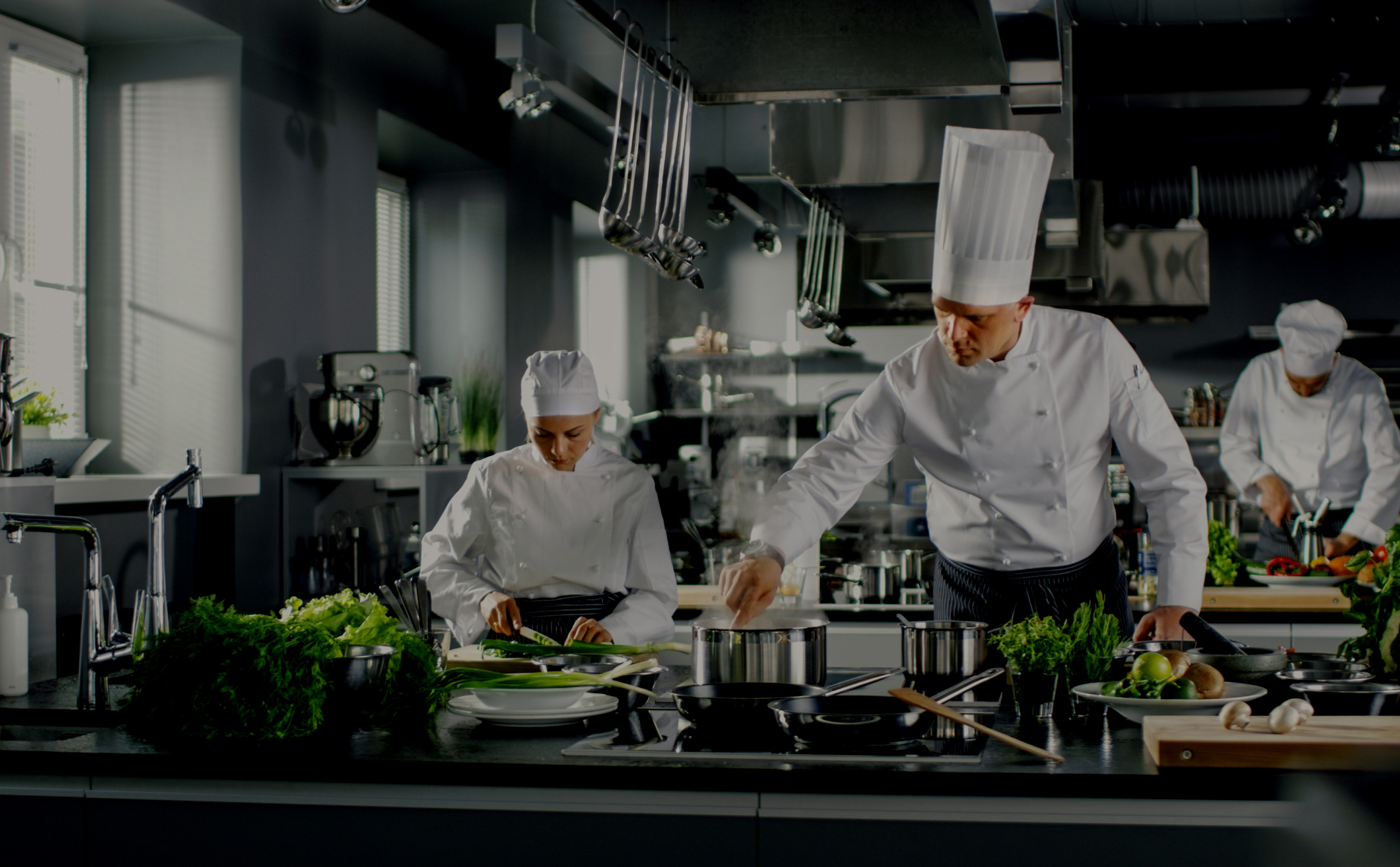 chefs working in a kitchen